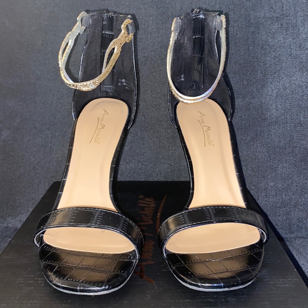 Black heels with gold ankle strap